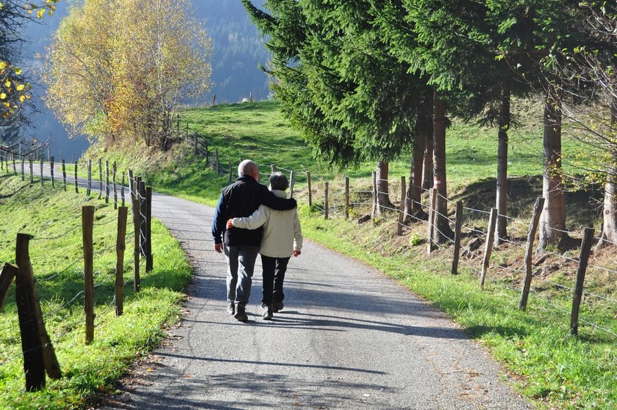 Couple walking on a country path